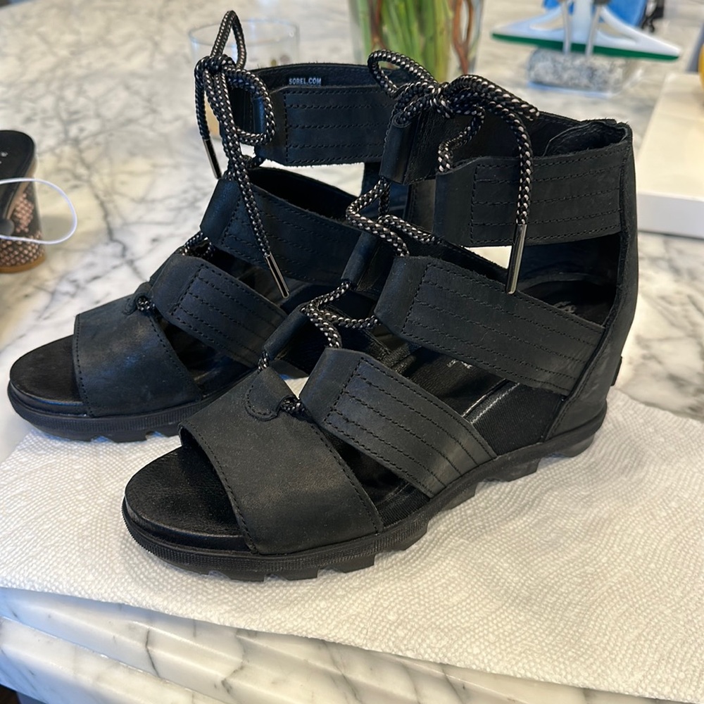 Lace-up, black Sorel wedges. Very good condition.